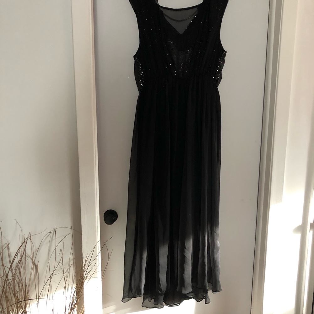 Sequins dress with necklace detail.